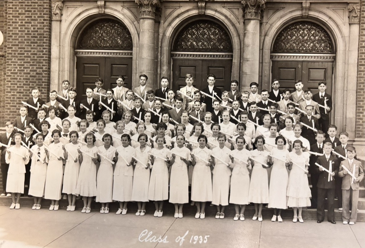 Holy Name's Class of 1935 on the church steps